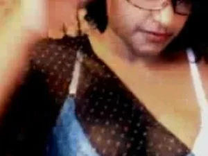 Desi teenage hottie sensually disrobes, revealing her enticing assets.